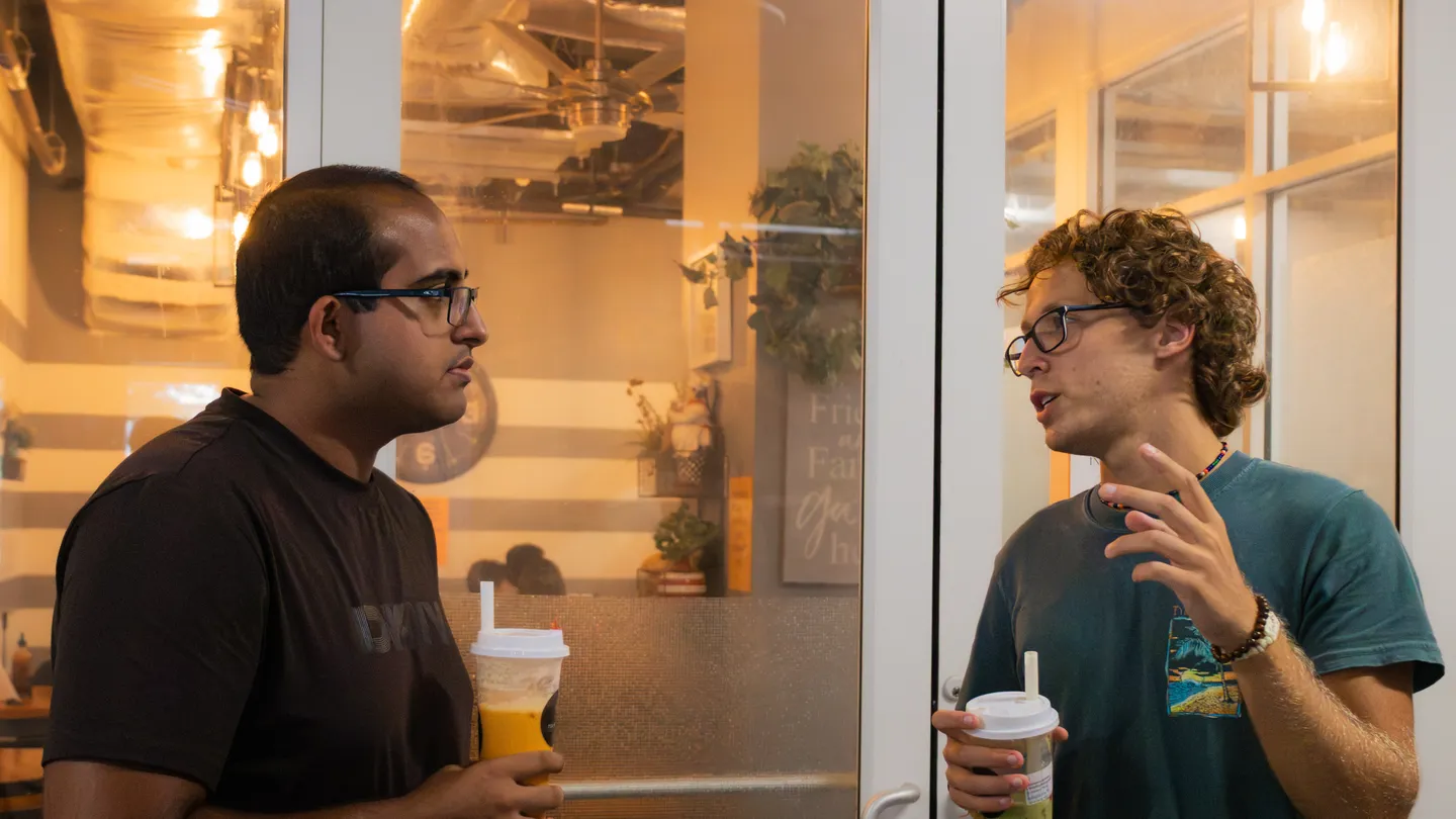 Two attendees talking with drinks at ELC’s 2026 Boba Social.